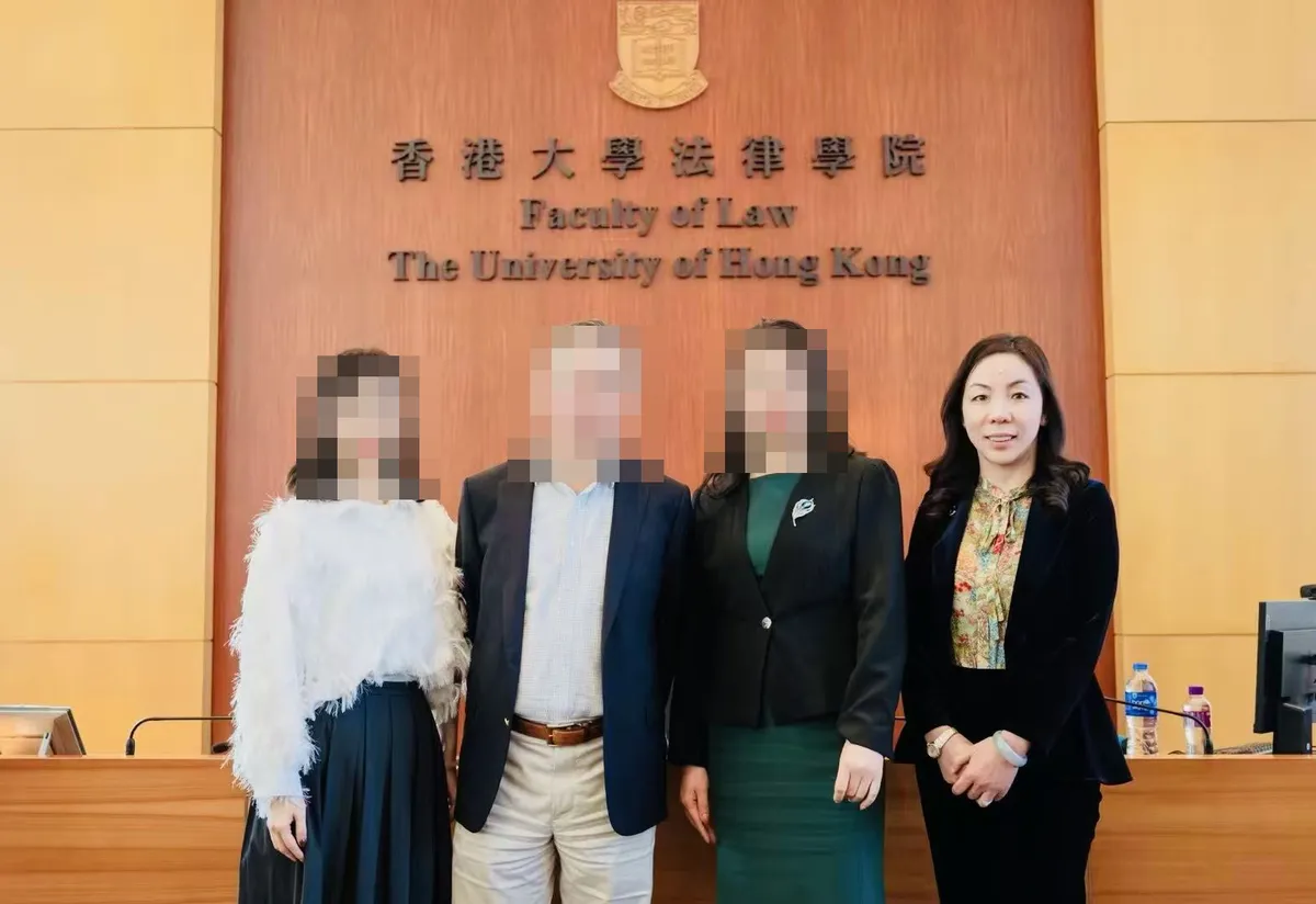 June Zhang with three others at the Faculty of Law, The University of Hong Kong