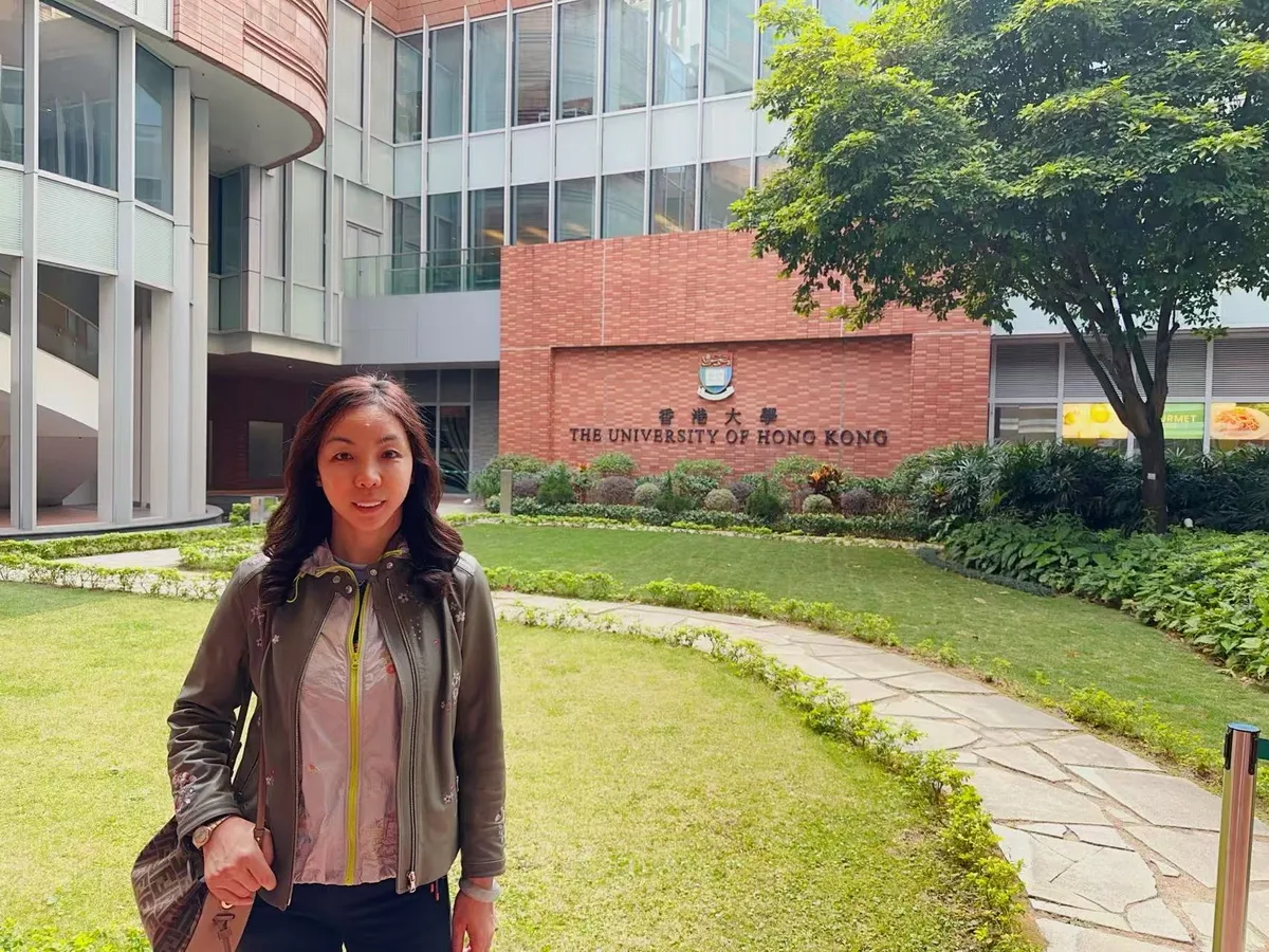 June Zhang outside a building of The University of Hong Kong