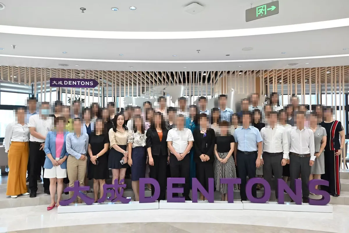June Zhang in a group photo at an exchange between lawyers