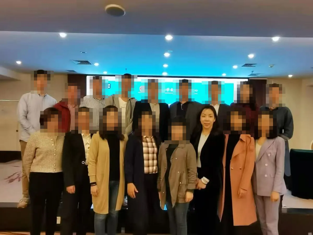 June Zhang with other lawyers at a training session